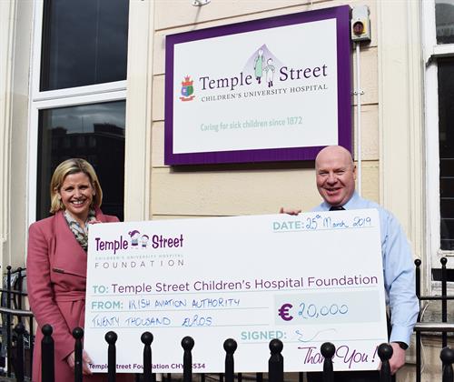 IAA Temple Street cheque handover Emma Barrett and Peter Kearney mid res